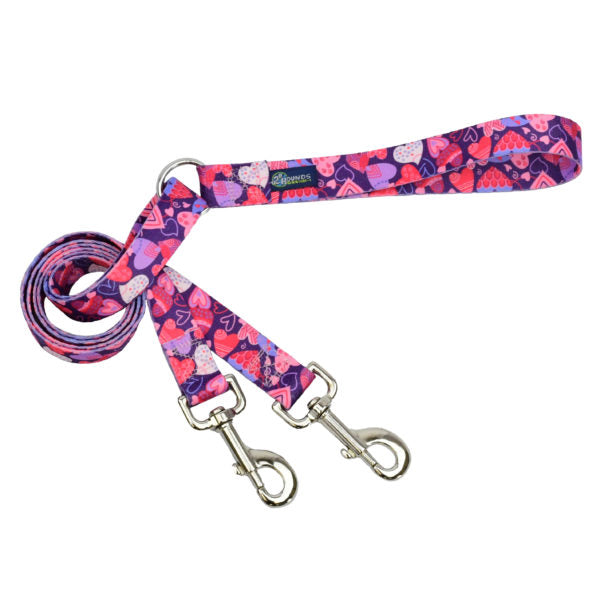 Purple and pink double connection dog leash featuring a heart pattern on durable webbing with silver metal hardware by 2 Hounds Design. - Earthstyle