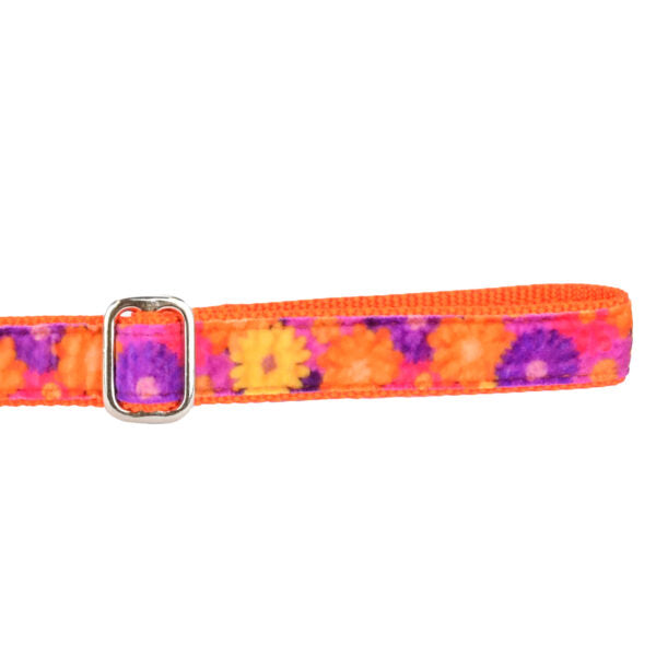 Close-up of orange, purple, and yellow floral pattern velvet dog leash handle with adjustable feature by 2 Hounds Design