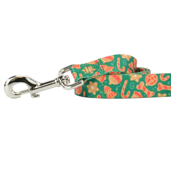 Close-up of dog leash with silver hardware featuring colorful cookie shapes on green background by 2 Hounds Design - Earthstyle