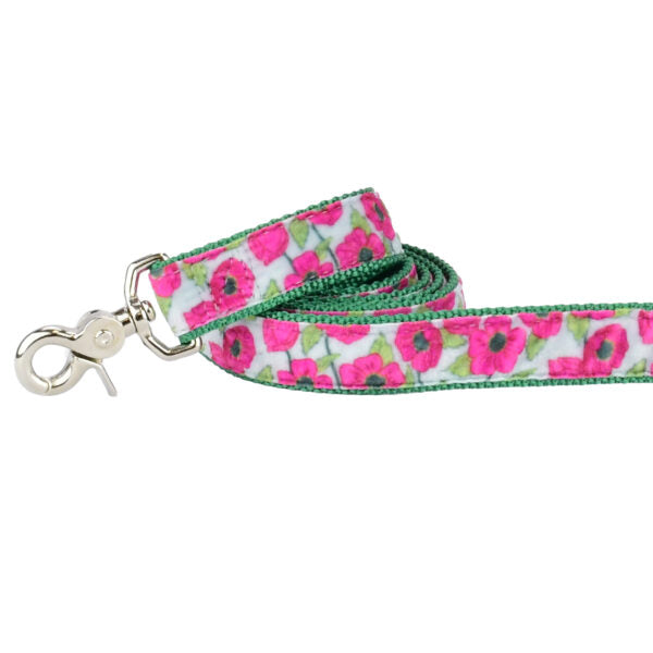 Close-up of pink floral pattern on green dog leash with silver hardware by 2 Hounds Design