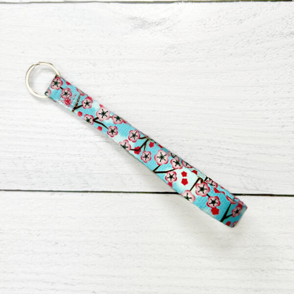 Cherry blossom print on light blue background keychain - EarthStyle