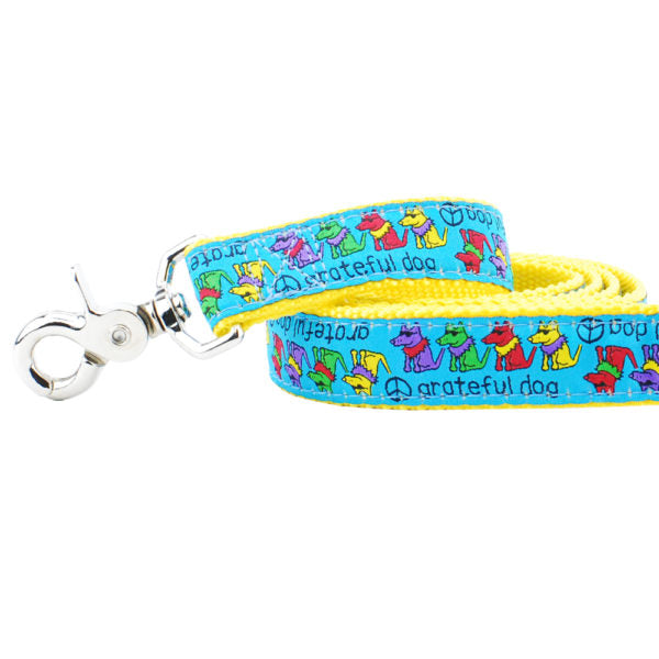Close-up of colorful dog leash with dancing cartoon dogs and peace signs – bright yellow and blue leash by 2 Hounds Design