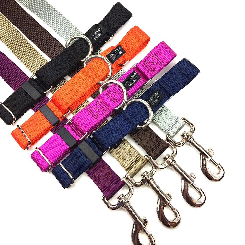 A collection of different colored 2 Hounds Design collars and leashes